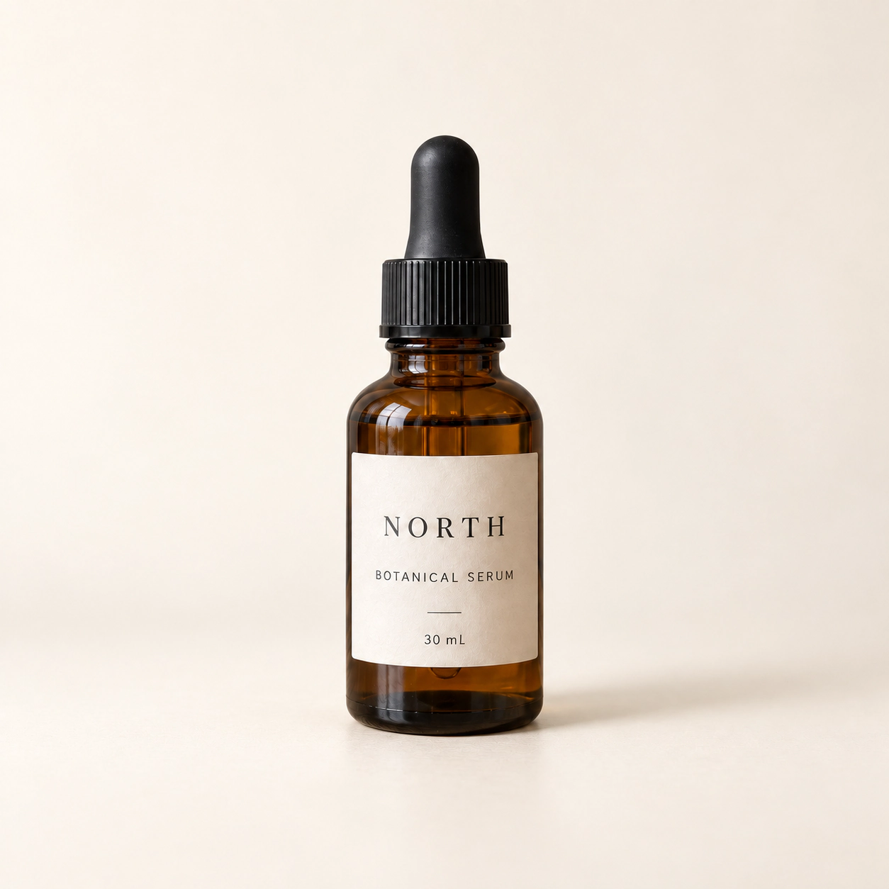 NORTH serum bottle on an off-white studio background with a soft rightward shadow